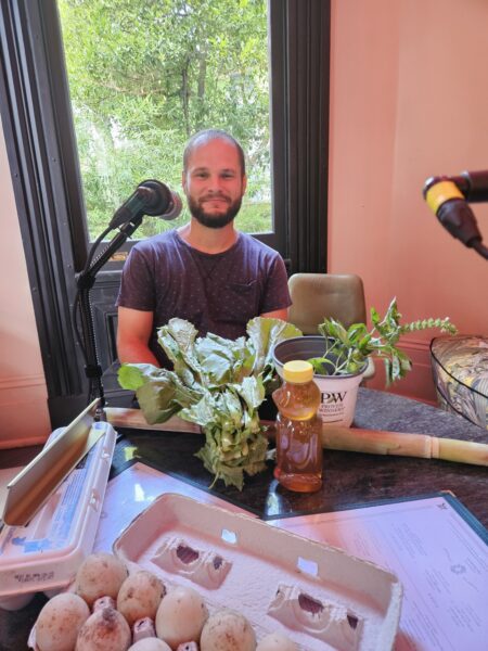 Andres Barcelo with some of the day's bounty from Barcelo Gardens Fresh Market - duck eggs, honey, sugarcane, greens and basil