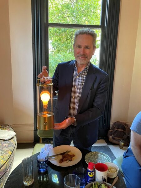 Anthony Robins demonstrates Tala's portable table lamp, Muse, one of the company's best-selling items